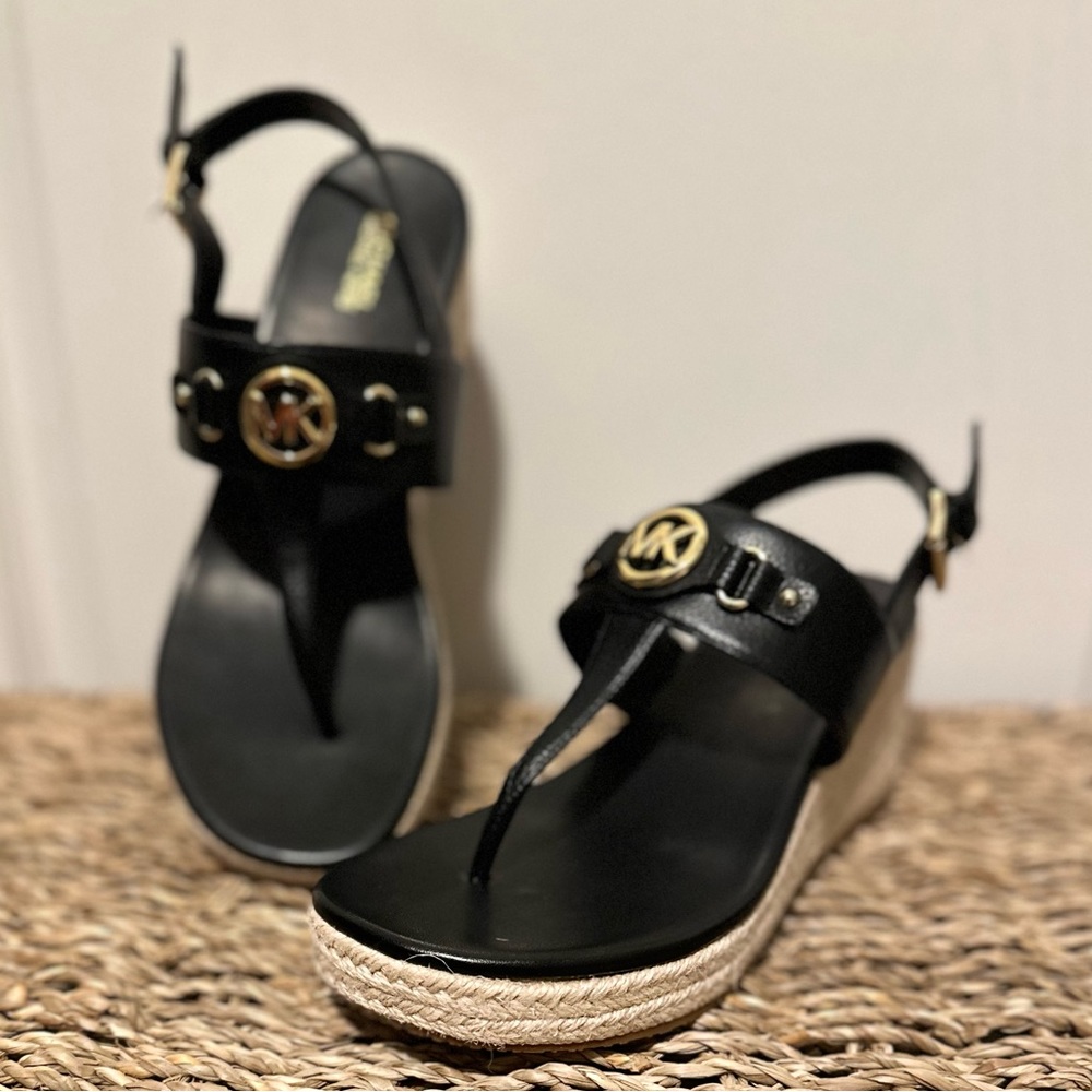 MicheL Kors black with gold accent wedged heels. Brand new, neve worn.